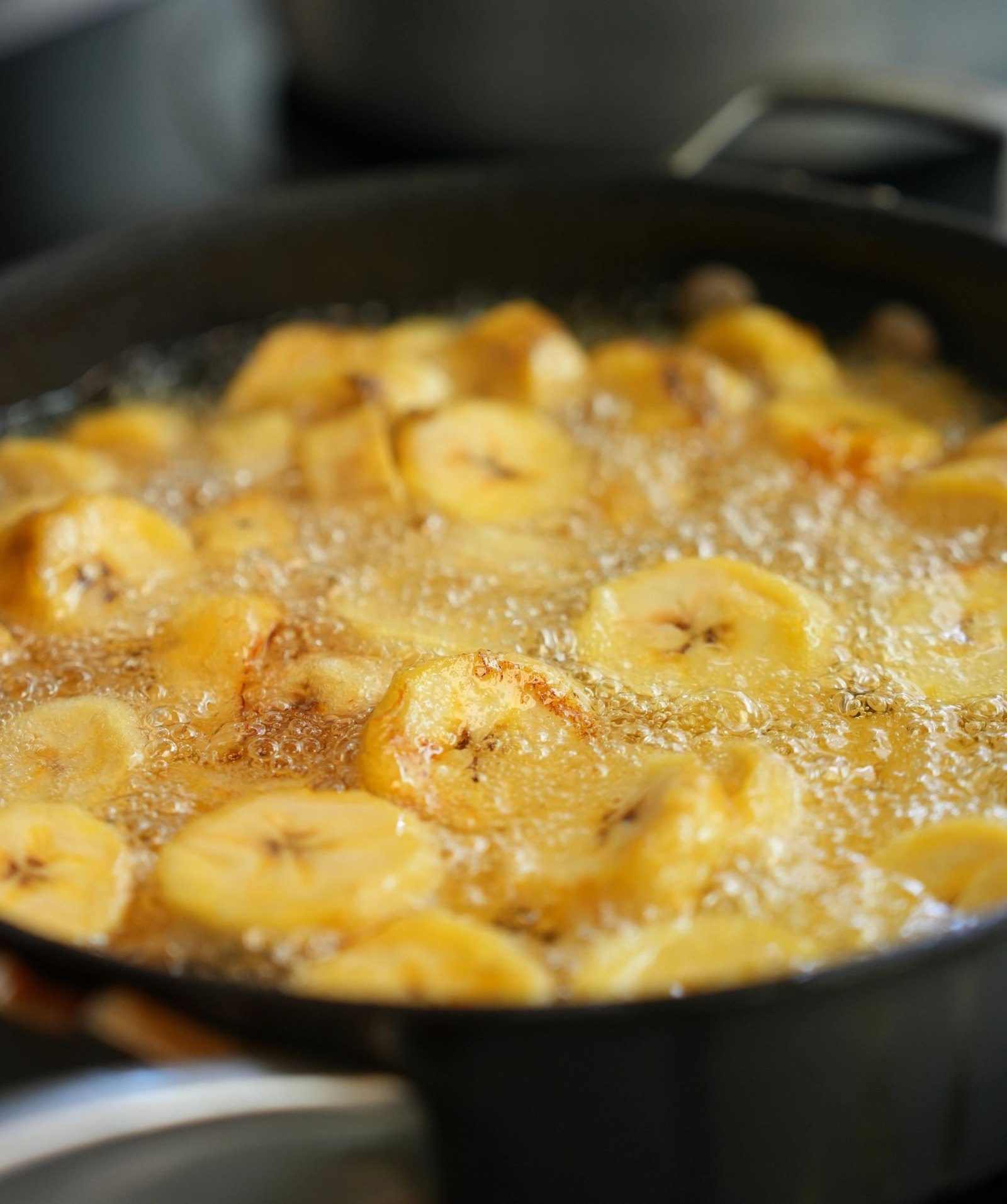 Plantains frying during the cooking session.