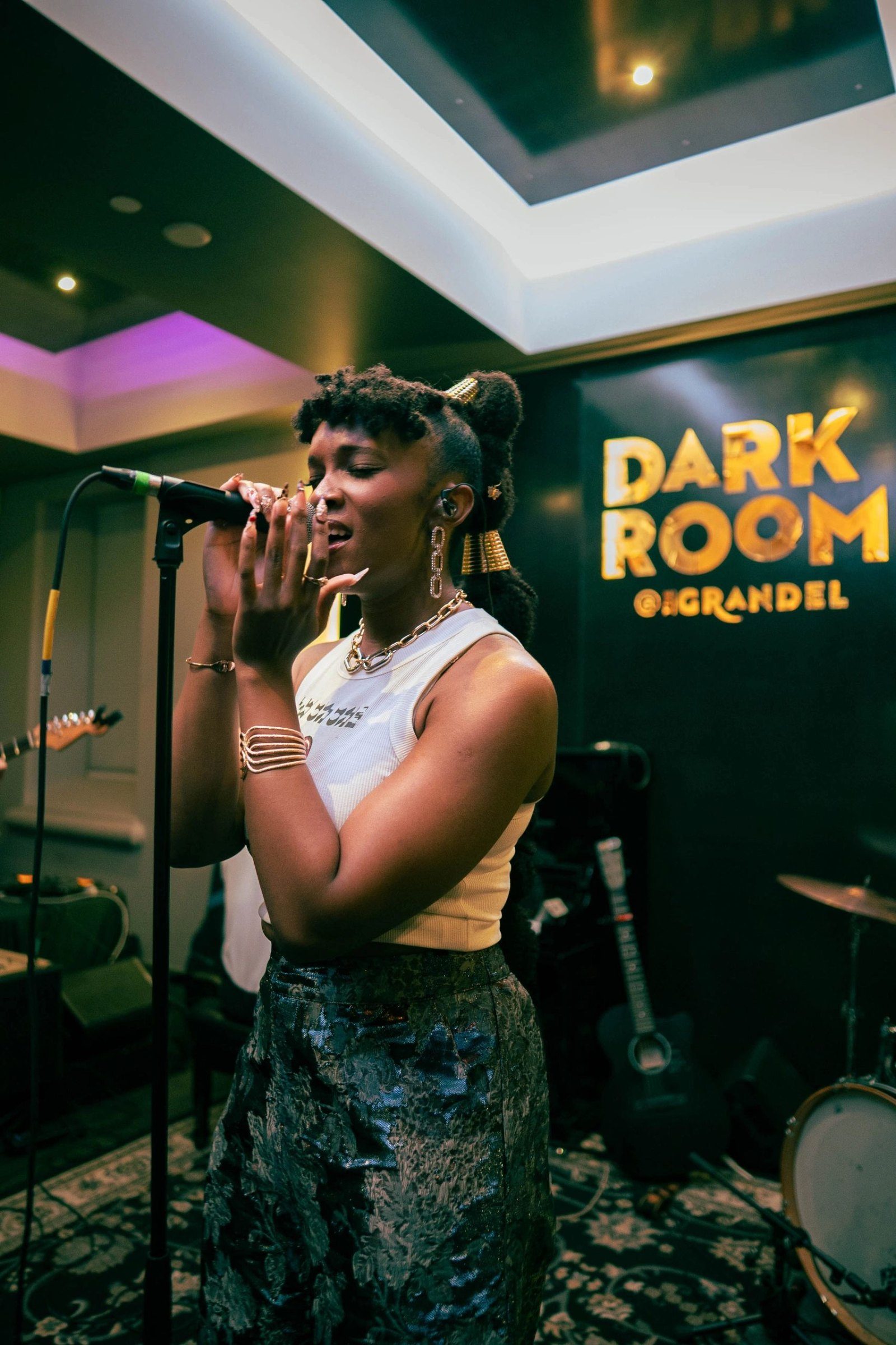 Florie singing at The Dark Room STL
